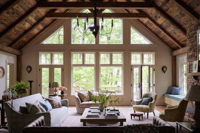 Example of a cottage dark wood floor, brown floor, exposed beam, vaulted ceiling and wood ceiling living room design in Nashville with beige walls