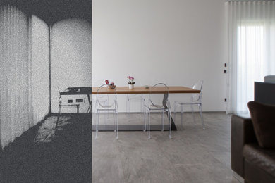 Diseño de comedor actual con paredes beige, suelo de baldosas de porcelana y suelo gris