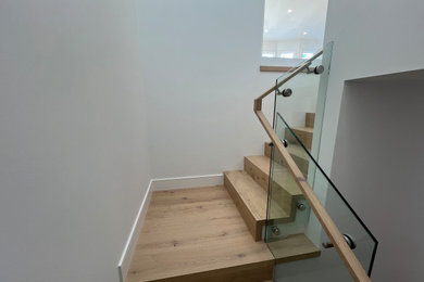 Staircase - mid-sized wooden l-shaped staircase idea in San Francisco with wooden risers