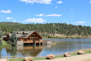 Inspiration for a rustic brown one-story wood gable roof remodel in Denver