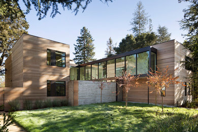 Contemporary two-storey house exterior in San Francisco with wood siding and a flat roof.