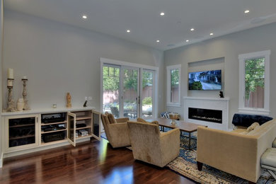 Living room - contemporary living room idea in San Francisco with a wall-mounted tv