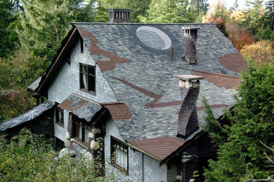 Eclectic gray wood exterior home idea in Seattle