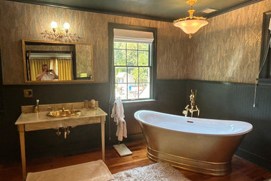 Bathroom - large contemporary master medium tone wood floor, brown floor, single-sink and wallpaper bathroom idea in Philadelphia with black cabinets, a bidet, green walls, an integrated sink, onyx countertops, orange countertops, a niche and a freestanding vanity