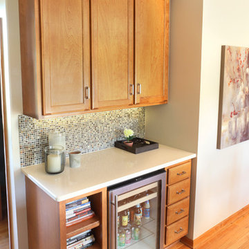 Beverage fridge, open shelving and bank of drawers replace an old unused desk ar