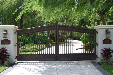 Photo of a mediterranean front yard driveway in Houston.