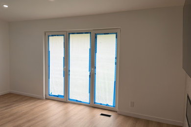 Example of a mid-sized minimalist living room design in Newark