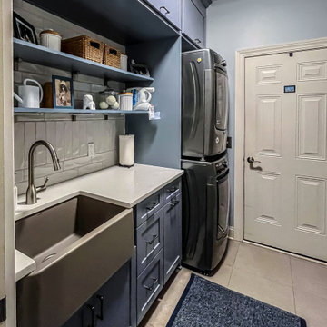 Laundry Room with Blue Painted Cabinetry and Sparkling White Quartz Countertops