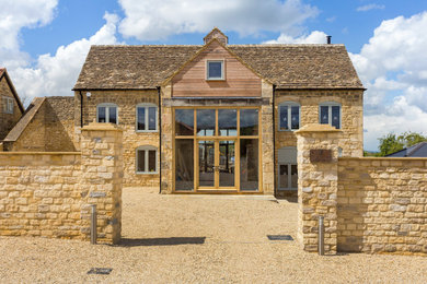Design ideas for a modern house exterior in Gloucestershire.