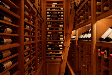 Example of a large classic brick floor wine cellar design in New York