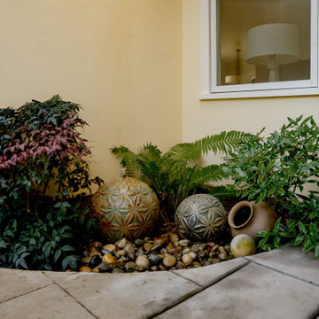 Sculptural Fountain with Ferns, Nandina, and Daphne