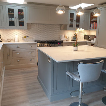 Traditional style beige kitchen with contrasting grey island