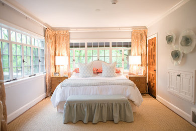Example of a classic carpeted and beige floor bedroom design in Austin with gray walls