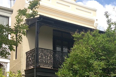 Traditional two-storey beige exterior in Melbourne.