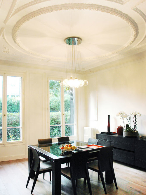 Idées déco pour une salle à manger contemporaine fermée et de taille moyenne avec un mur beige.