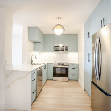 Modern Open-Concept Condo Kitchen with Quartz Waterfall Peninsula – North Vancou