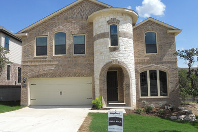 Inspiration for a craftsman red two-story brick exterior home remodel in Austin