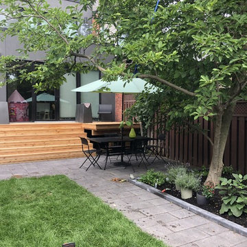 Modern Backyard Patio with Cedar Deck and Stone Patio in Toronto