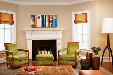 Example of a mid-sized transitional enclosed dark wood floor family room design in New York with beige walls, a standard fireplace, a tv stand and a stone fireplace