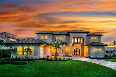 Example of a huge transitional home design design in Miami