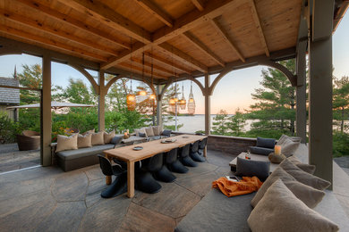 Design ideas for a craftsman courtyard stone retaining wall landscape in Toronto.