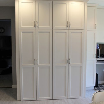 Alpha, IL White and Gray Kitchen with Hidden Laundry and Raised Dishwasher