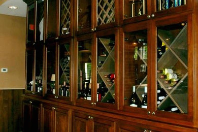 Mid-sized elegant medium tone wood floor wine cellar photo in Chicago