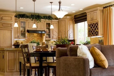 Example of a mid-sized classic l-shaped ceramic tile and beige floor open concept kitchen design in Philadelphia with an undermount sink, beaded inset cabinets, light wood cabinets, granite countertops, brown backsplash, mosaic tile backsplash, paneled appliances and an island
