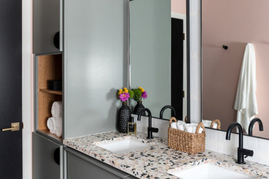 Trendy white tile black floor and double-sink bathroom photo in Austin with flat-panel cabinets, gray cabinets, pink walls, an undermount sink, terrazzo countertops, multicolored countertops and a floating vanity