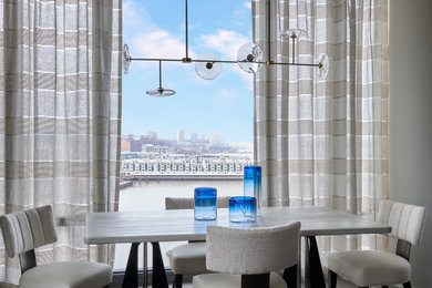 Example of a mid-sized trendy medium tone wood floor and beige floor breakfast nook design in New York