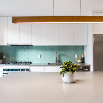 White Modern Kitchen with Green Tile Backsplash