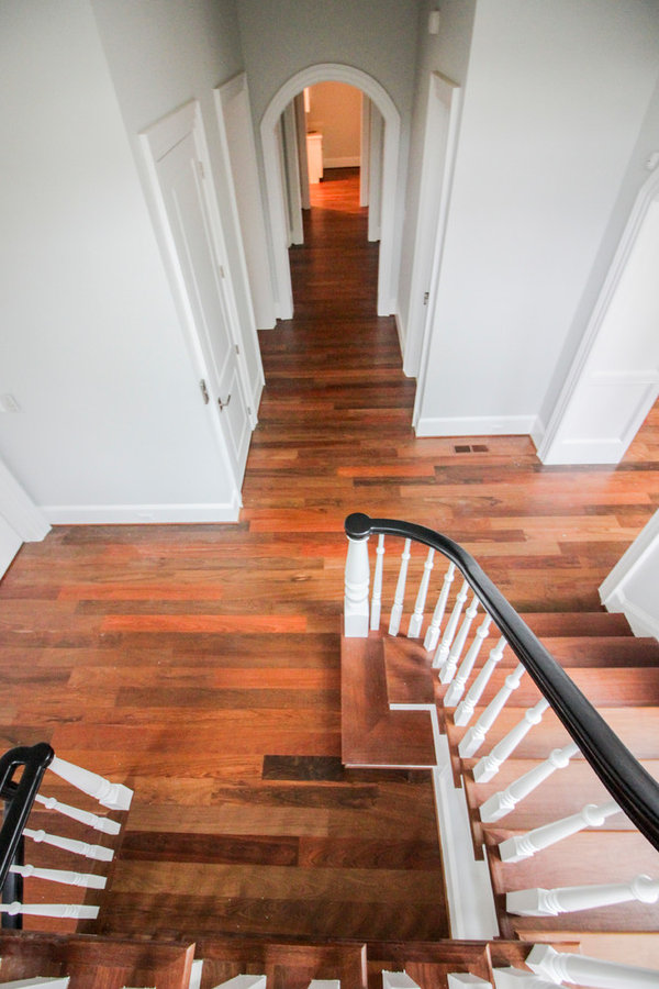 Powerful Impression by Floating Staircase in Suburban Foyer