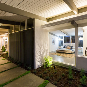 Egg Chair in Eichler Style Home with Orange Front Door