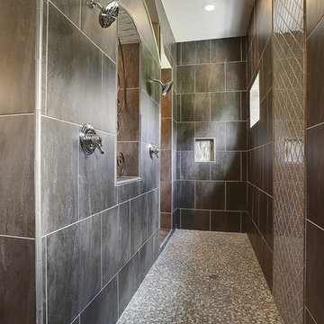 Incredible master shower with open window to the rest of the bath
