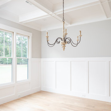 Dining Room with Wainscot Paneling and Picture Windows