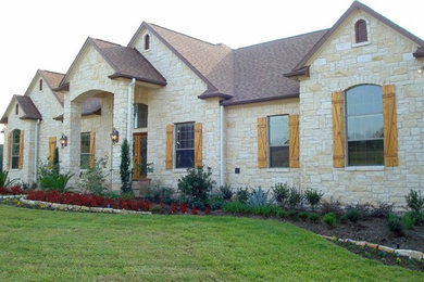 Elegant stone exterior home photo in Houston