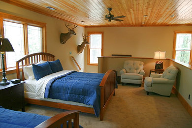 Inspiration for a rustic loft-style carpeted bedroom remodel in Other with beige walls