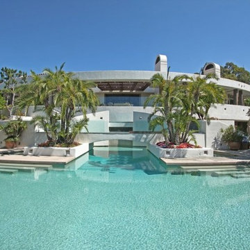 Massive pool surrounded by outdoor furniture done by our team