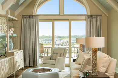 Inspiration for a large transitional open concept ceramic tile and brown floor family room remodel in Other with beige walls and a tv stand
