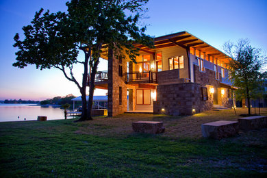 Mid-sized contemporary two-story metal exterior home idea in Austin with a shed roof