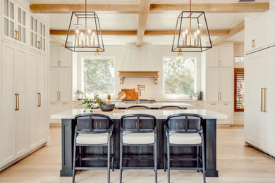 Example of a huge transitional kitchen design in Dallas with two islands