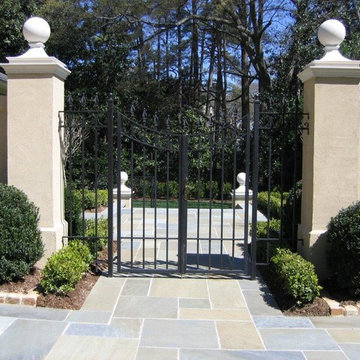 Wrought Iron Backyard gates features Stucco columns and walls with Precast Caps