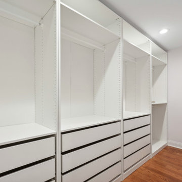 Walk-In Closet with Drawer Bank and Hanging Rods
