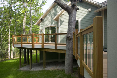 Example of an arts and crafts deck design in Other