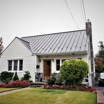Installing Galvalume Standing Seam Metal Roof and Huron Drystack Stone