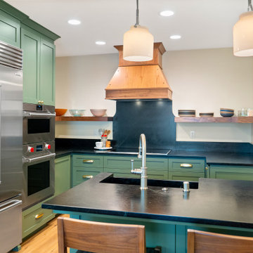 Turquoise Kitchen Cabinets and Black Marble Countertops