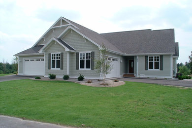 Large traditional one-story exterior home idea in Other