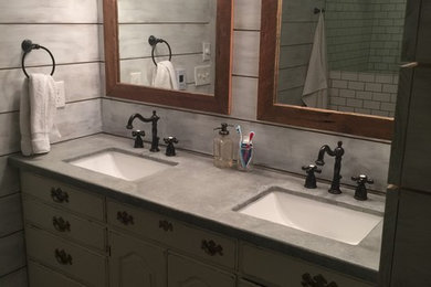 Example of a cottage bathroom design in Cincinnati with concrete countertops