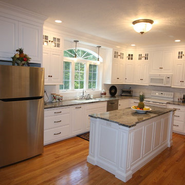 Custom White Kitchen with Scottish Meadow Granite tops