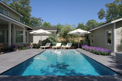 Example of a large backyard concrete and rectangular lap hot tub design in Los Angeles